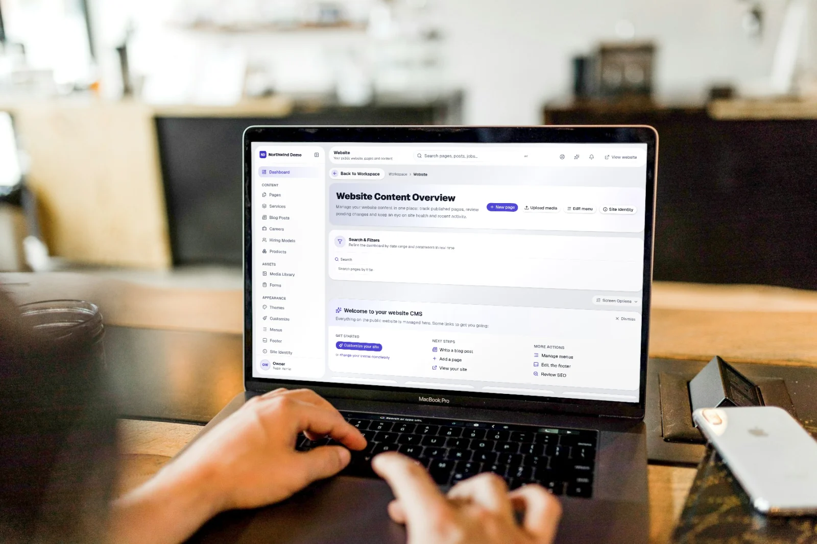 SelfRun Sites — real screen of the product on a laptop