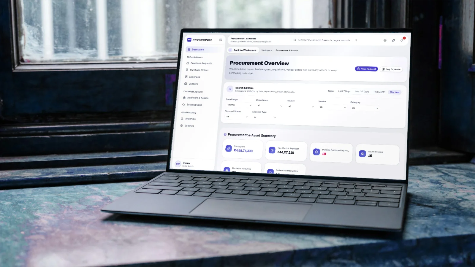 SelfRun SpendIQ — real screen of the product on a laptop